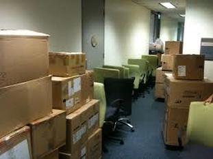 Photo of Packed Boxes in Hallway